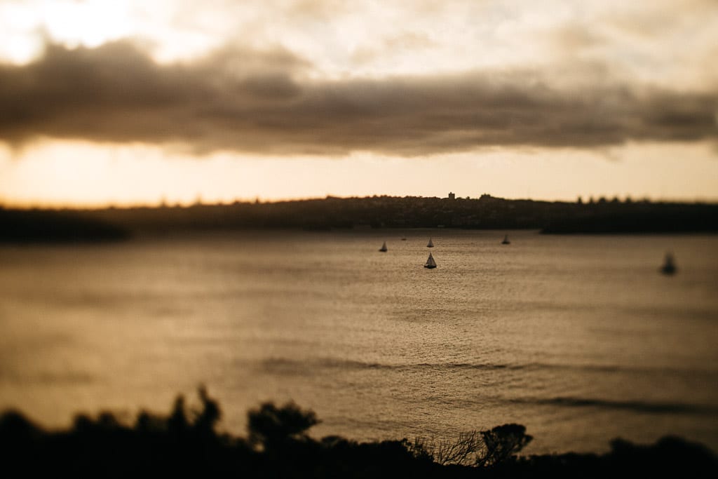 Reflective moment with yachts on the water before a storm